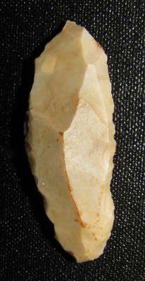 a piece of bread sitting on top of a black surface