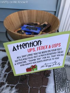 a basket full of chocolates sitting in front of a sign that says attention up's fedex & usps