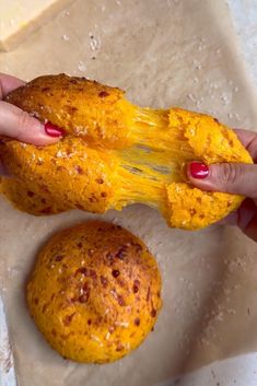 a person is peeling something off of a piece of bread with yellow paint on it