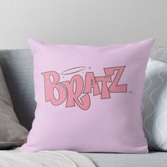 a pink pillow with the word bratz on it