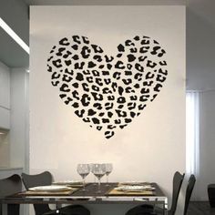 a heart shaped animal print wall decal with the words, just peel and stick cheetah print wall decals