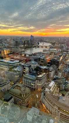 an aerial view of the city at sunset