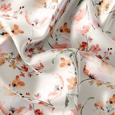 an orange and pink floral print on white fabric