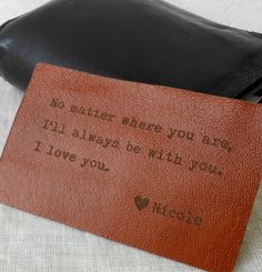 a brown leather wallet with a quote on the front and back side that says, no matter where you are i'll always be with you