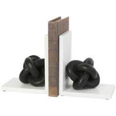 two black and white bookends are shown with one on top of the other