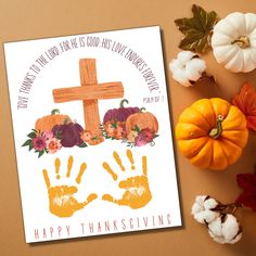 a thanksgiving card with a cross and handprints on it next to pumpkins