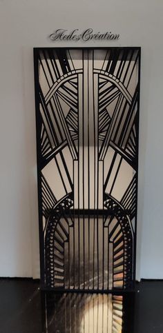 an art deco fireplace screen in black and white