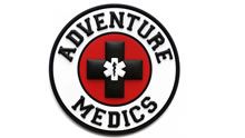 the adventure medics logo is shown in black and red with a cross on it