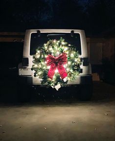 a christmas wreath on the back of a truck