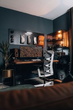 a room with a chair, desk and shelves