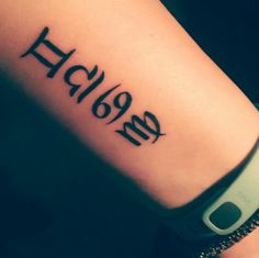 a woman's arm with the word hello written on it