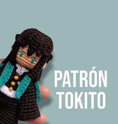 a crocheted doll is in the palm of someone's hand that says patron tokio