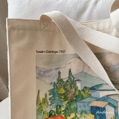 a tote bag with a painting on it