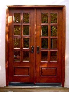 two wooden doors sitting next to each other