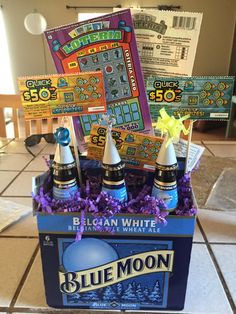 blue moon beer is sitting in a box on the floor