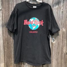 Vintage 90's Hard Rock Cafe Orlando t-shirt. Tagged a large, but please read measurements before buying. Shirt has some minor fading around the shoulders, light wear on the graphic, and some minor pilling. Message me with any questions and thanks for looking! Check out my other vintage shirts. Measurements: Armpit to armpit - 22.5 inches. Shoulder to hem - 30.5 inches. Usa Shirt, Rock Cafe, Hard Rock Cafe, Vintage Shirts, Hard Rock, Orlando, Tee Shirts, Mens Accessories, Adult Outfits