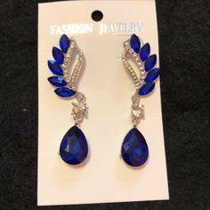 Gorgeous Blue Crystal Drop Earrings For Formal Occasions, Blue Teardrop Jewelry For Evening, Blue Dangle Crystal Earrings For Formal Occasions, Blue Crystal Earrings For Party, Blue Dangle Crystal Earrings For Evening, Teardrop Blue Jewelry For Party, Blue Teardrop Jewelry For Party, Blue Teardrop Earrings For Evening, Elegant Royal Blue Earrings For Party