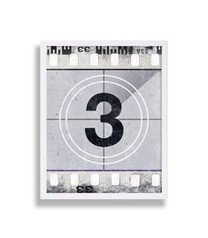 a film strip with the number three in it's center and an image of a camera