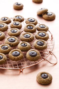 some cookies with googly eyes are on a cooling rack