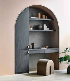 an arch - shaped shelf with shelves and vases on it