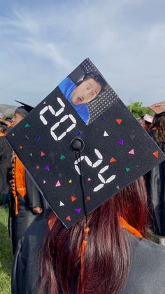 a graduate's cap with the number twenty five on it is decorated with confetti