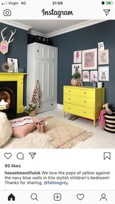 a living room filled with furniture and pictures on the wall next to a fire place