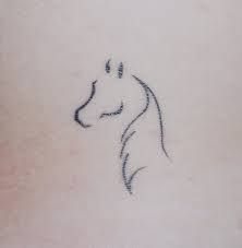 a small tattoo of a horse on the back of a woman's stomach