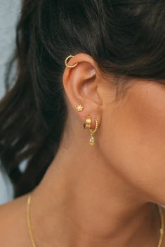 Triple the huggie, triple the vibe. A beloved item when you want to spice up your jewelry looks for the evening. ✦ Measures 12mm / Gold-Plated over Brass *This huggie is sold as a single Handmade in Bali Triple Ear Piercing, 3 Ear Piercings, Triple Piercing, Jewelry Looks, Stacked Earrings, Ear Stack, Stacked Jewelry, Cheap Jewelry