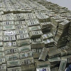 stacks of money sitting on top of each other