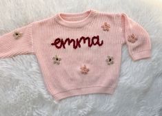 Hand embroidered sweaters Embroidered Crew Neck Knit Sweater, Winter Crew Neck Sweater With Letter Embroidery, Cute Floral Embroidered Sweater For Fall, Cute Floral Embroidery Sweater For Fall, Cute Embroidered Spring Sweater, Cute Embroidered Knit Tops, Winter Sweater With Letter Embroidery, Embroidered Knit Tops For Fall, Pink Winter Tops With Custom Embroidery