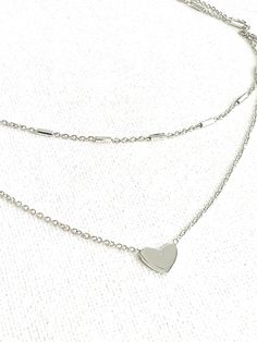 Sterling SILVER small HEART NECKLACE . little heart necklace . tiny heart necklace . double strand heart necklace . heart necklace . 925 rhodium plated sterling silver . Material: 925 Sterling Silver, Rhodium Plated finish . Chains thickness: 2 mm . Length: Adjustable 14 -16" . Heart pendant size: 10 mm x 7 mm . Closure: Spring ring . Reusable gift box . Please let me know if you need more details or photos FREE SHIPPING, 1-2 day processing time 6 month warranty Thank you very much for looking! Small Heart Necklace, Letter Necklace Silver, Tiny Heart Necklace, Double Layer Necklace, Double Strand Necklace, Map Necklace, Layer Necklace, Necklace Heart, Chain Extenders