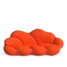 an orange couch sitting on top of a white floor