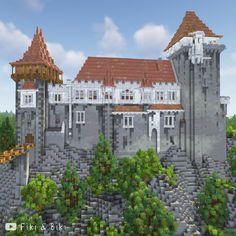 a large castle sitting on top of a lush green forest next to a tall building