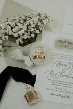 wedding stationery with rings, ring box and flowers