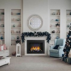 a living room filled with furniture and a fire place next to a christmas tree in front of a fireplace