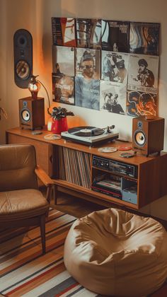 a living room with a record player, speakers and a bean bag chair in it