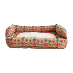 a dog bed with flowers on it