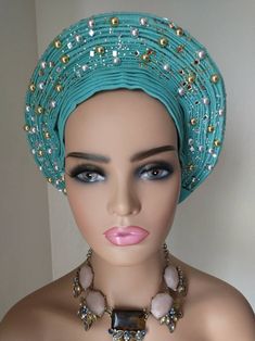 Teal colored embellished Asoke. Traditional Fitted Headscarf, Traditional Headwrap For Party, Traditional Adjustable Headscarf For Wedding, Traditional Party Headwrap Headband, Traditional Party Headwrap, Traditional Adjustable Turban For Parties, Traditional Party Headwrap One Size, Traditional Adjustable Headwrap For Party, Adjustable Traditional Headwrap For Parties