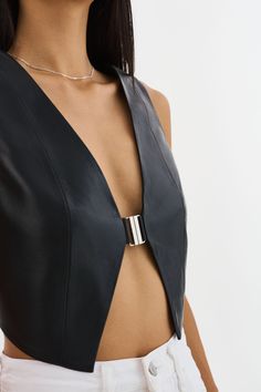 A luxe essential that effortlessly merges edgy sophistication with understated elegance. With its daringly deep V-neckline, the ESTRELLA exudes a confident allure that's perfect for both day and night. Pair with high-waisted trousers for a polished daytime look or layer under a structured blazer for evening chic to bring a touch of edge to any outfit. Leather Vest Top, Leather Top Outfit, Edgy Tops, Techno Outfit, Leather Tops, Structured Blazer, Edgy Accessories, Black White Outfit, Fashion Top Outfits