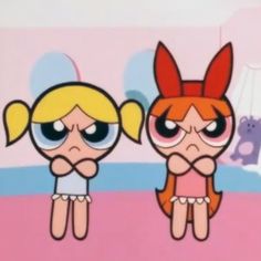 the powerpuff girls are standing next to each other