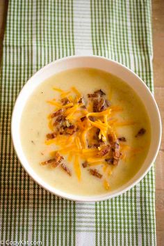 a white bowl filled with soup on top of a table