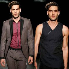 two men walking down the runway at a fashion show, one wearing a vest and tie