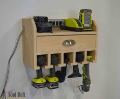 a workbench with tools hanging from it's wall and attached to the wall