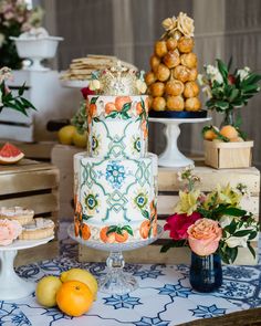 a table topped with lots of different types of cakes and desserts on top of it