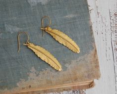 gold feather earrings Gold Feather Earrings As A Gift, Gold Feather Earrings For Gift, Gold Feather Earrings, Blue Beaded Earrings, Bainbridge Island, Gold Feathers, Blue Feather, Nature Birds, Feather Charms