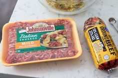 two containers of food sitting on top of a counter