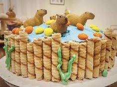 there is a cake that looks like some sort of animal crackers on top of it