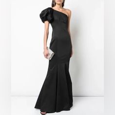 Zac Zac Posen One-Shoulder Stretch Faille Mermaid Gown In Black. -One Shoulder Neckline -Right Cap Sleeve; Sleeveless Left -Mermaid Silhouette -Floor-Length Hem -Side Zip -Acetate/Nylon/Spandex Runs A Little Bit Small. Formal One-shoulder Fitted Gown, Off-shoulder Ruffled Gown For Formal Events, Off-shoulder Ruffled Gown For Formal Occasions, Formal Off-shoulder Ruffled Gown, Fitted One Shoulder Evening Gown, Formal Evening One Shoulder Floor-length Dress, Black Fitted One-shoulder Wedding Dress, Black Fitted One Shoulder Wedding Dress, Black Fitted One Shoulder Dress For Wedding