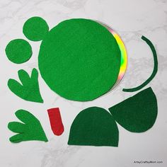 an image of a green frog cut out from felt