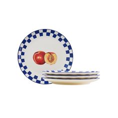 three blue and white plates with apples on them